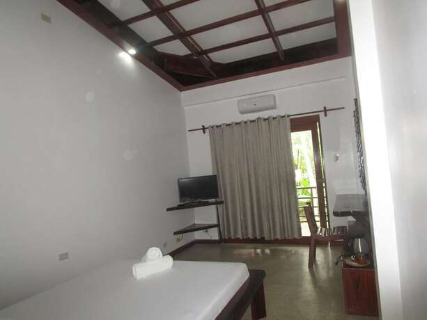 Imagen de la habitación del Hotel Ocean 101 Beach Resort. Foto 26