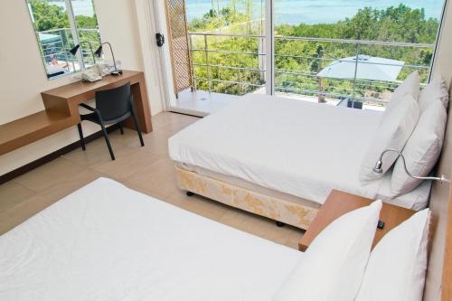 Imagen de la habitación del Hotel Ocean Suites Bohol Boutique. Foto 7
