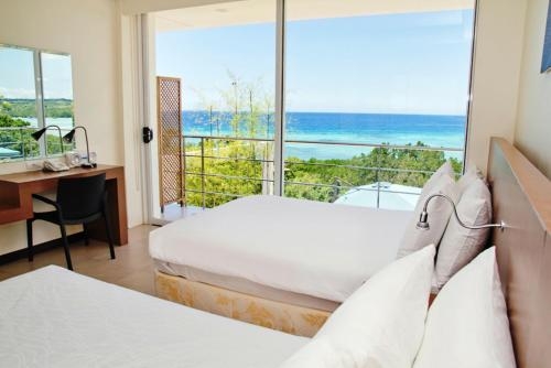 Imagen de la habitación del Hotel Ocean Suites Bohol Boutique. Foto 8