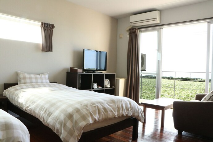 Imagen de la habitación del Hotel OceanVilla Yuninohama. Foto 33