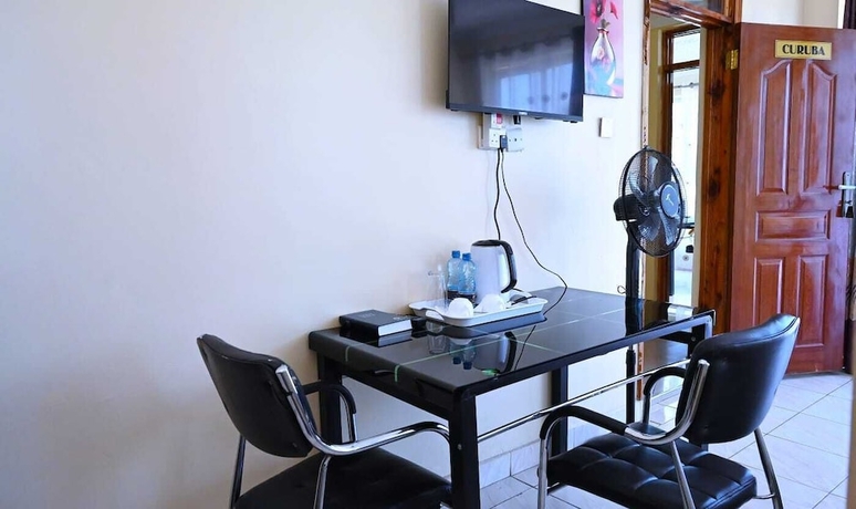Imagen del bar/restaurante del Hotel Odelia Gardens Limited. Foto 5