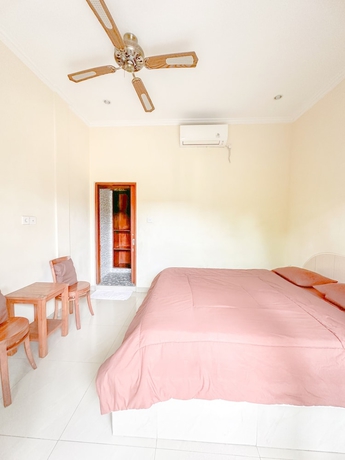 Imagen de la habitación del Hotel Ojeks Homestay. Foto 13
