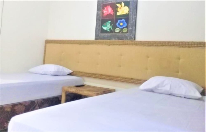 Imagen de la habitación del Hotel Oka Homestay. Foto 9