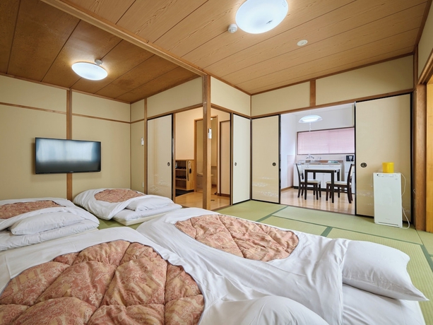 Imagen de la habitación del Hotel Okasan. Foto 2