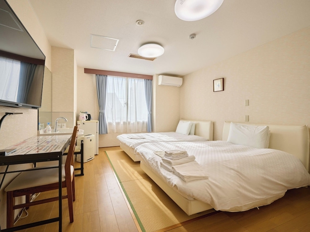 Imagen de la habitación del Hotel Okasan. Foto 4