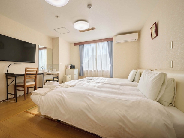 Imagen de la habitación del Hotel Okasan. Foto 5