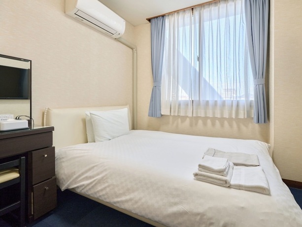 Imagen de la habitación del Hotel Okasan. Foto 8
