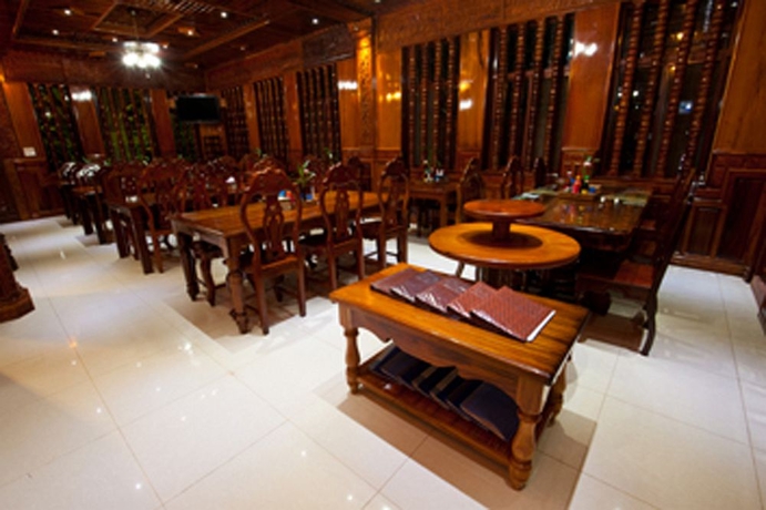 Imagen del bar/restaurante del Hotel Okay 1 Villa. Foto 6