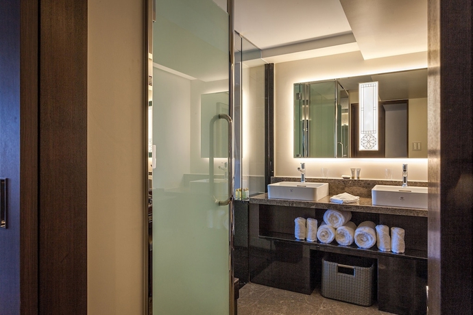 Imagen de la habitación del Hotel Okinawa Kariyushi Resort Exes Naha. Foto 11