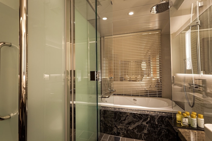 Imagen de la habitación del Hotel Okinawa Kariyushi Resort Exes Naha. Foto 12