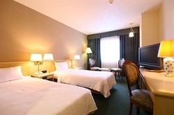 Imagen de la habitación del Hotel Okinawa Kariyushi Ryukyu Naha. Foto 4