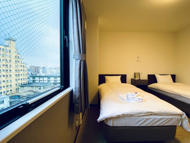 Imagen de la habitación del Hotel Okini Namba. Foto 6