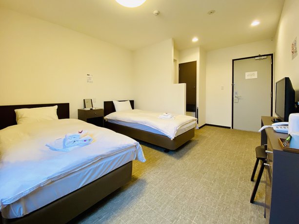 Imagen de la habitación del Hotel Okini Namba. Foto 11