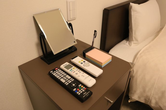 Imagen de la habitación del Hotel Okini Namba. Foto 16