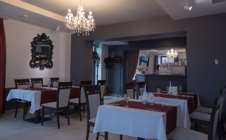 Imagen del bar/restaurante del Hotel Old Mill Comfort. Foto 4