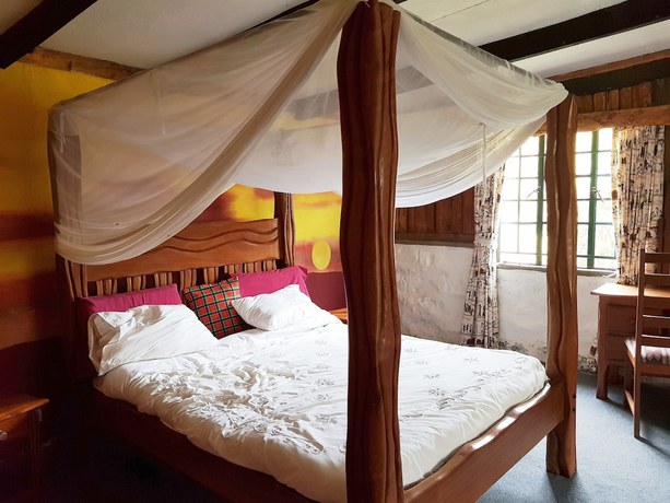 Imagen de la habitación del Hotel Ole Itiko Cottages. Foto 7