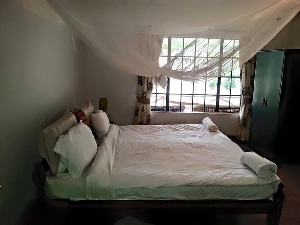 Imagen de la habitación del Hotel Ole Itiko Cottages. Foto 11