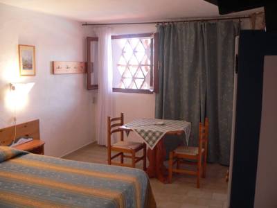 Imagen de la habitación del Hotel Olimpia, Baja Sardinia. Foto 5