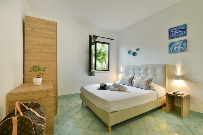 Imagen de la habitación del Hotel Olimpia Cilento Resort. Foto 7