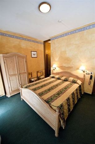 Imagen de la habitación del Hotel Olimpia, Cortina d'Ampezzo . Foto 7