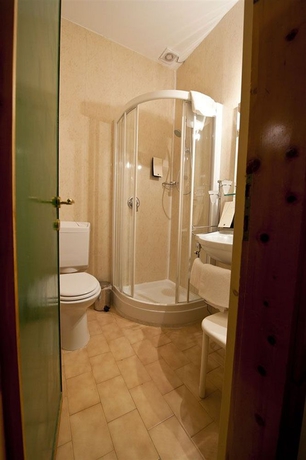 Imagen de la habitación del Hotel Olimpia, Cortina d'Ampezzo . Foto 9