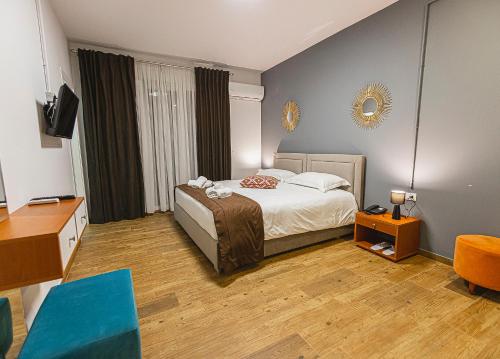 Imagen de la habitación del Hotel Olivar Tirana. Foto 16