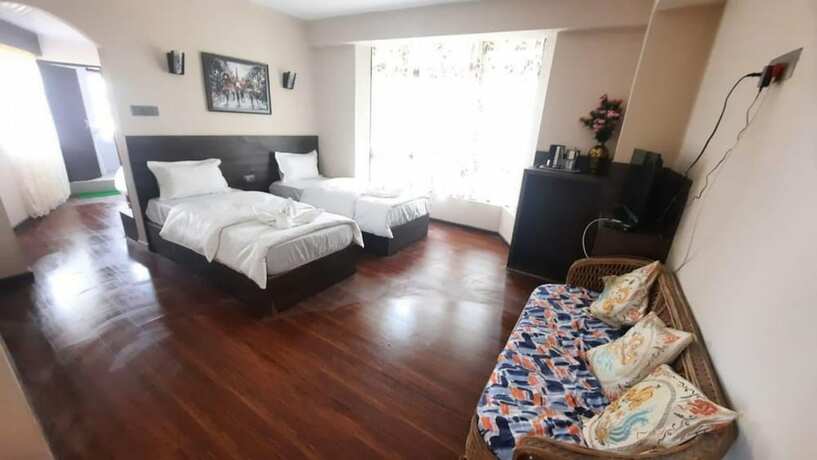 Imagen de la habitación del Hotel Olive Branch Darjeeling. Foto 17