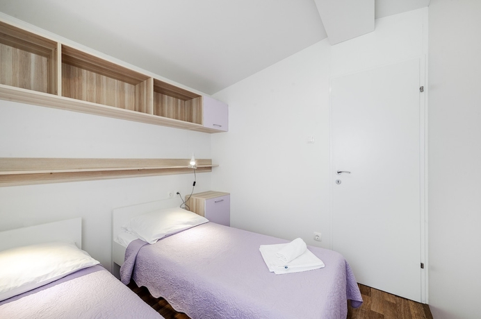 Imagen de la habitación del Hotel Olive Garden Camp Resort. Foto 3