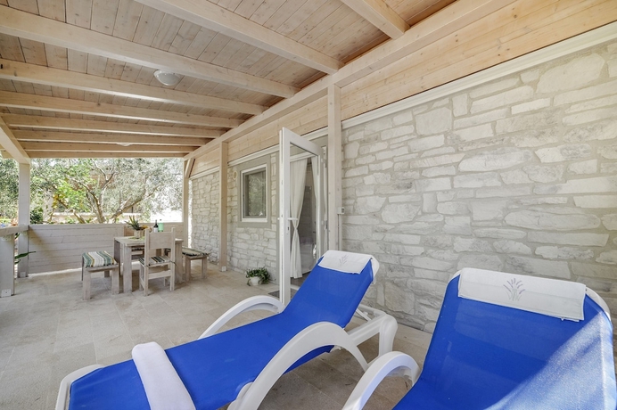 Imagen de la habitación del Hotel Olive Garden Camp Resort. Foto 6