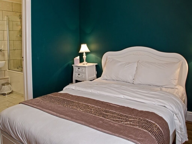 Imagen de la habitación del Hotel Olivers Lodge. Foto 11