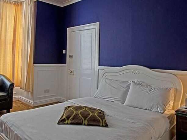 Imagen de la habitación del Hotel Olivers Lodge. Foto 12