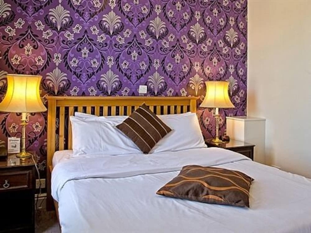 Imagen de la habitación del Hotel Olivers Lodge. Foto 13