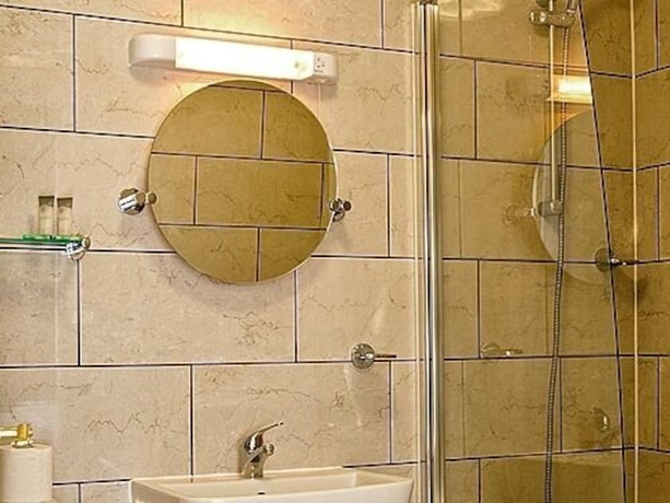 Imagen de la habitación del Hotel Olivers Lodge. Foto 17