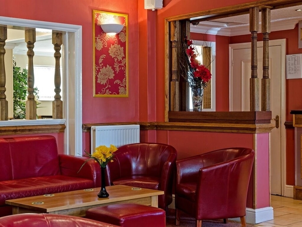 Imagen del bar/restaurante del Hotel Olivers Lodge. Foto 5