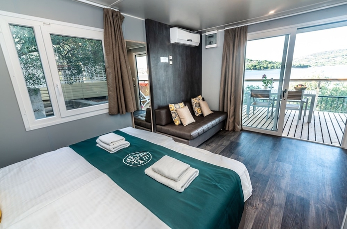 Imagen de la habitación del Hotel Olivia Green Camping. Foto 18