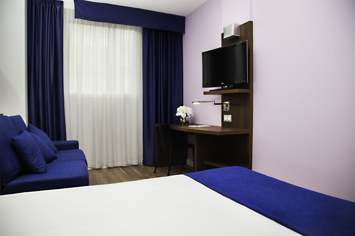 Imagen de la habitación del Hotel Olympia Universidades. Foto 13