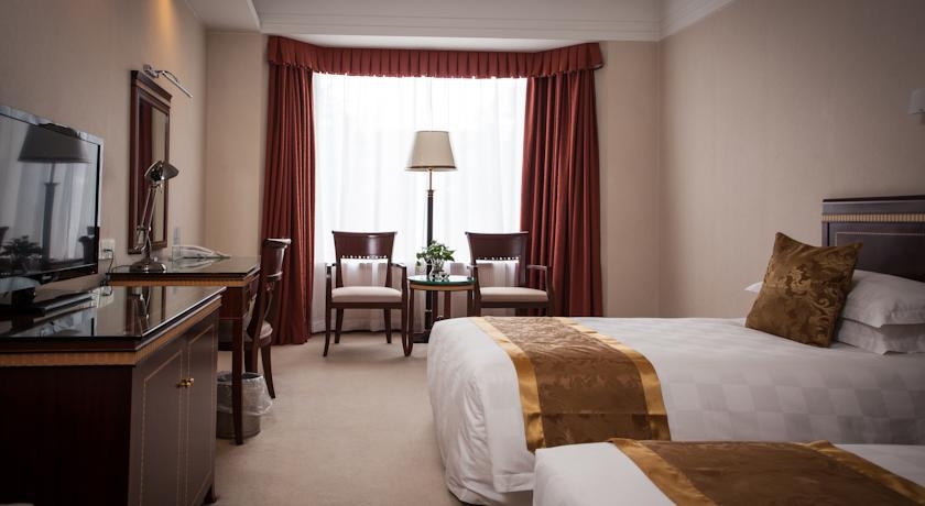 Imagen de la habitación del Hotel Olympic Club Hotel, Xujiahui. Foto 6