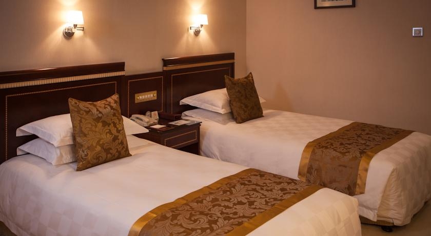 Imagen de la habitación del Hotel Olympic Club Hotel, Xujiahui. Foto 8