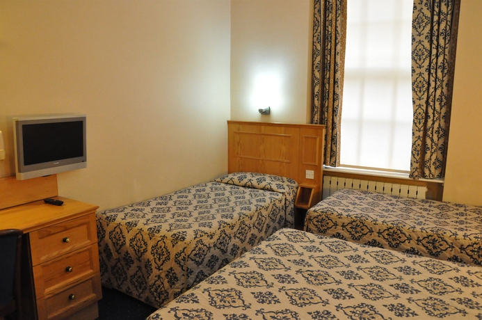 Imagen de la habitación del Hotel Olympic House. Foto 8