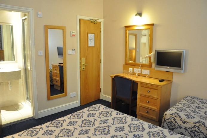 Imagen de la habitación del Hotel Olympic House. Foto 12