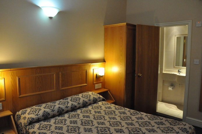 Imagen de la habitación del Hotel Olympic House. Foto 13