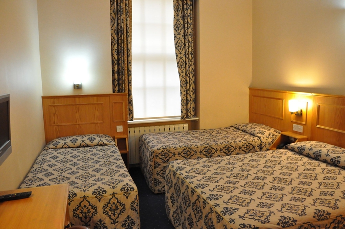 Imagen de la habitación del Hotel Olympic House. Foto 16