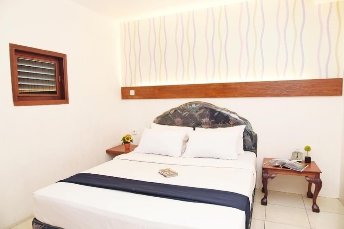 Imagen de la habitación del Hotel Olympic, Sekayu. Foto 9