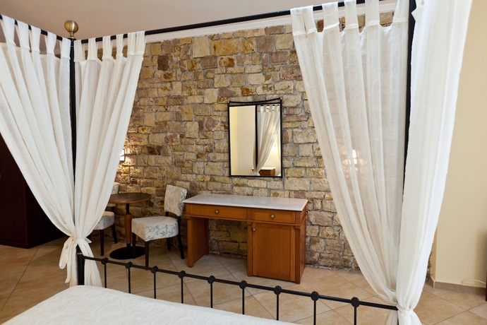 Imagen de la habitación del Hotel Olympic Village and Spa. Foto 10