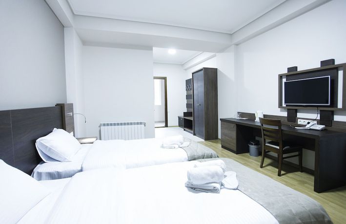 Imagen de la habitación del Hotel Olympus By Umbrella. Foto 8