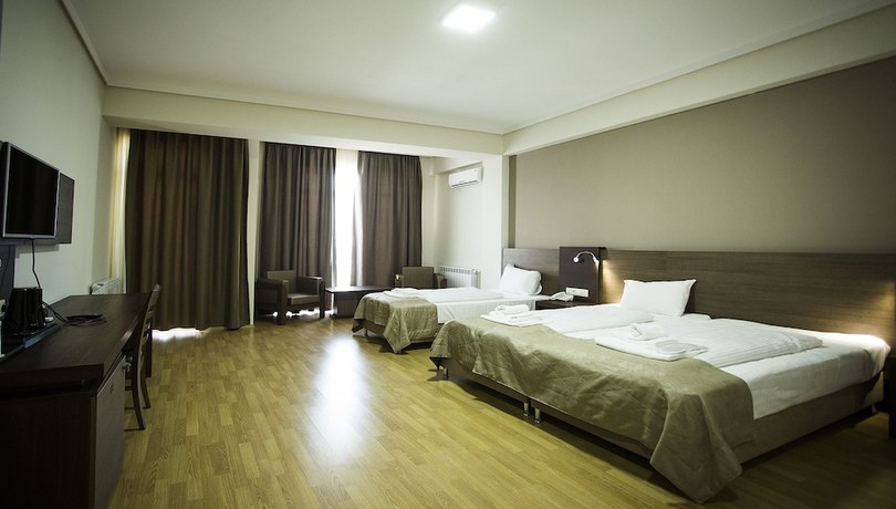Imagen de la habitación del Hotel Olympus By Umbrella. Foto 9