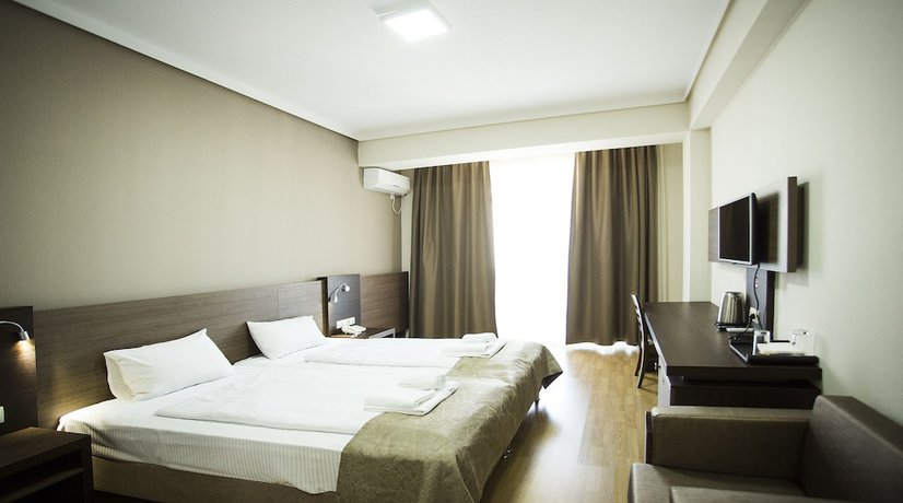 Imagen de la habitación del Hotel Olympus By Umbrella. Foto 11