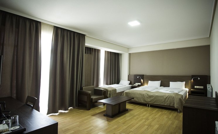 Imagen de la habitación del Hotel Olympus By Umbrella. Foto 12