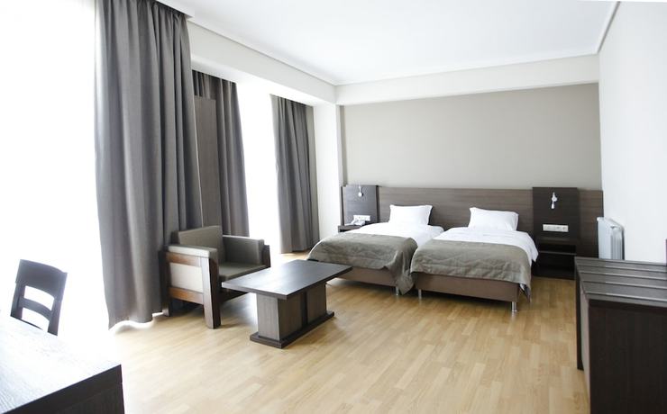 Imagen de la habitación del Hotel Olympus By Umbrella. Foto 13