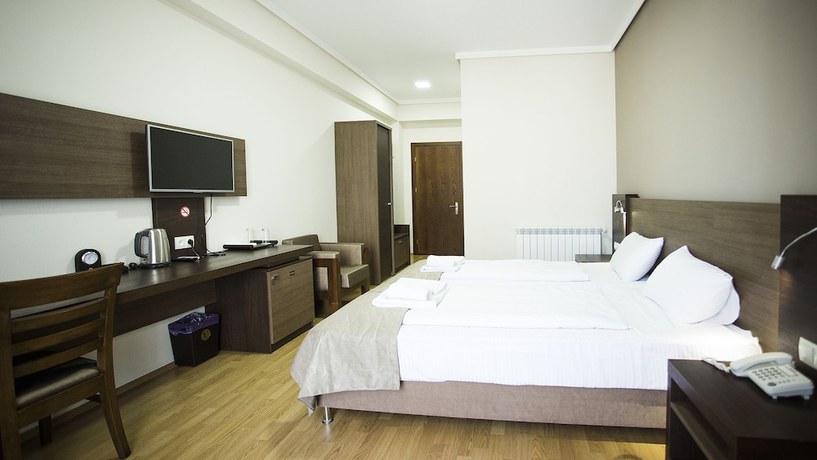 Imagen de la habitación del Hotel Olympus By Umbrella. Foto 19